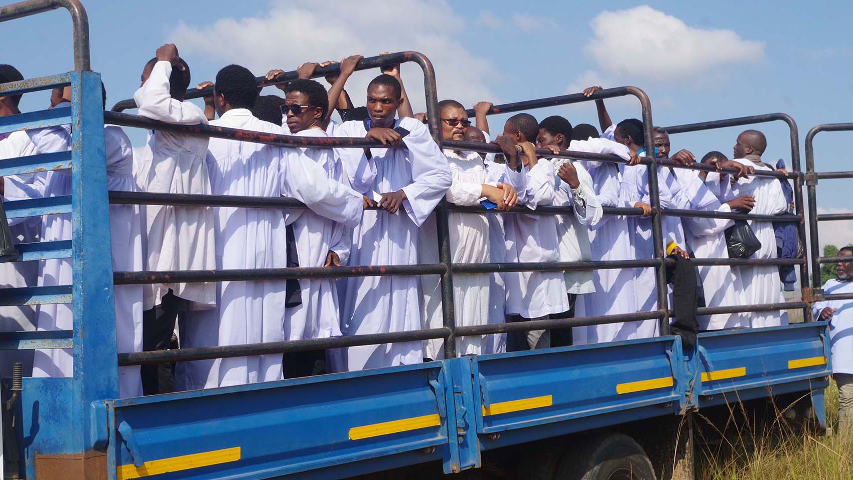 Some of the members of the Nazareth Baptist Church leaving the river in a truck after baptism.
